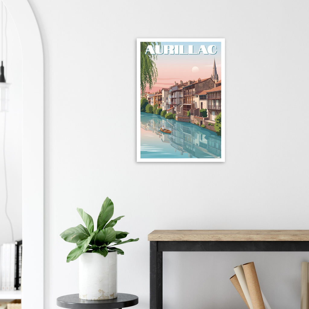 Poster de voyage d'Aurillac sous cadre posé sur une console en bois clair