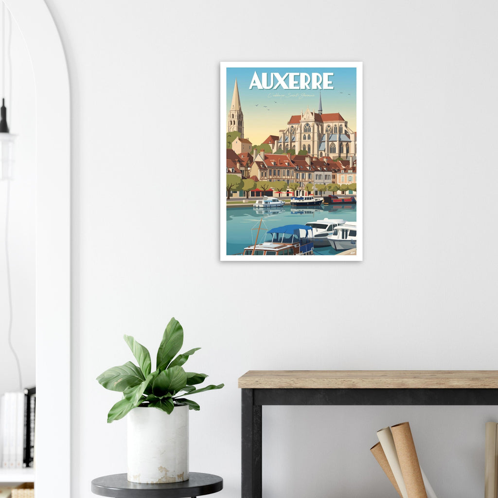 Poster de voyage d'Auxerre sous cadre posé sur une console en bois clair