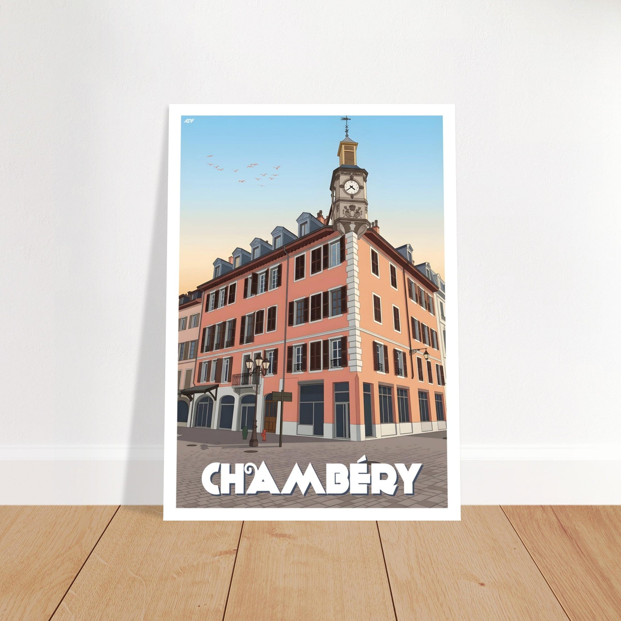 Grand tirage d'art sous cadre du poster de Chambéry posé au sol sur parquet en bois