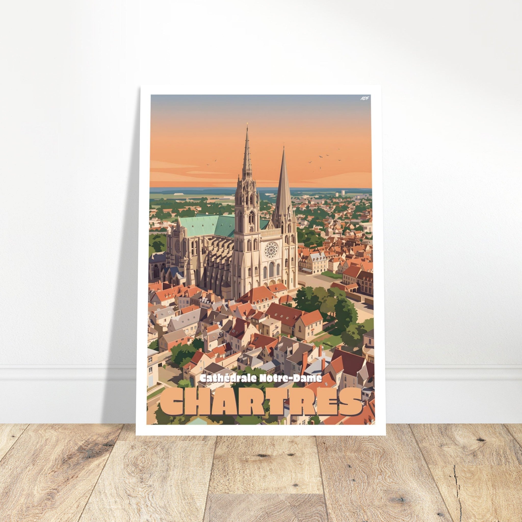 Grand tirage d'art encadré de la cathédrale de Chartres posé sur du parquet clair