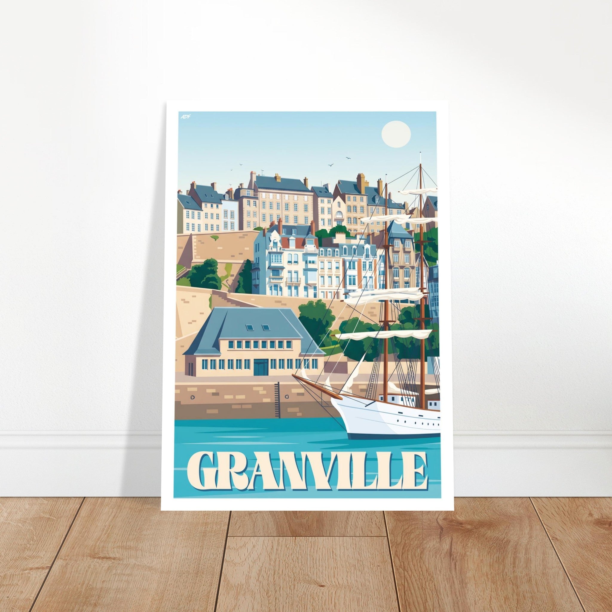 Cadre mural avec le poster de Granville posé sur parquet en chêne