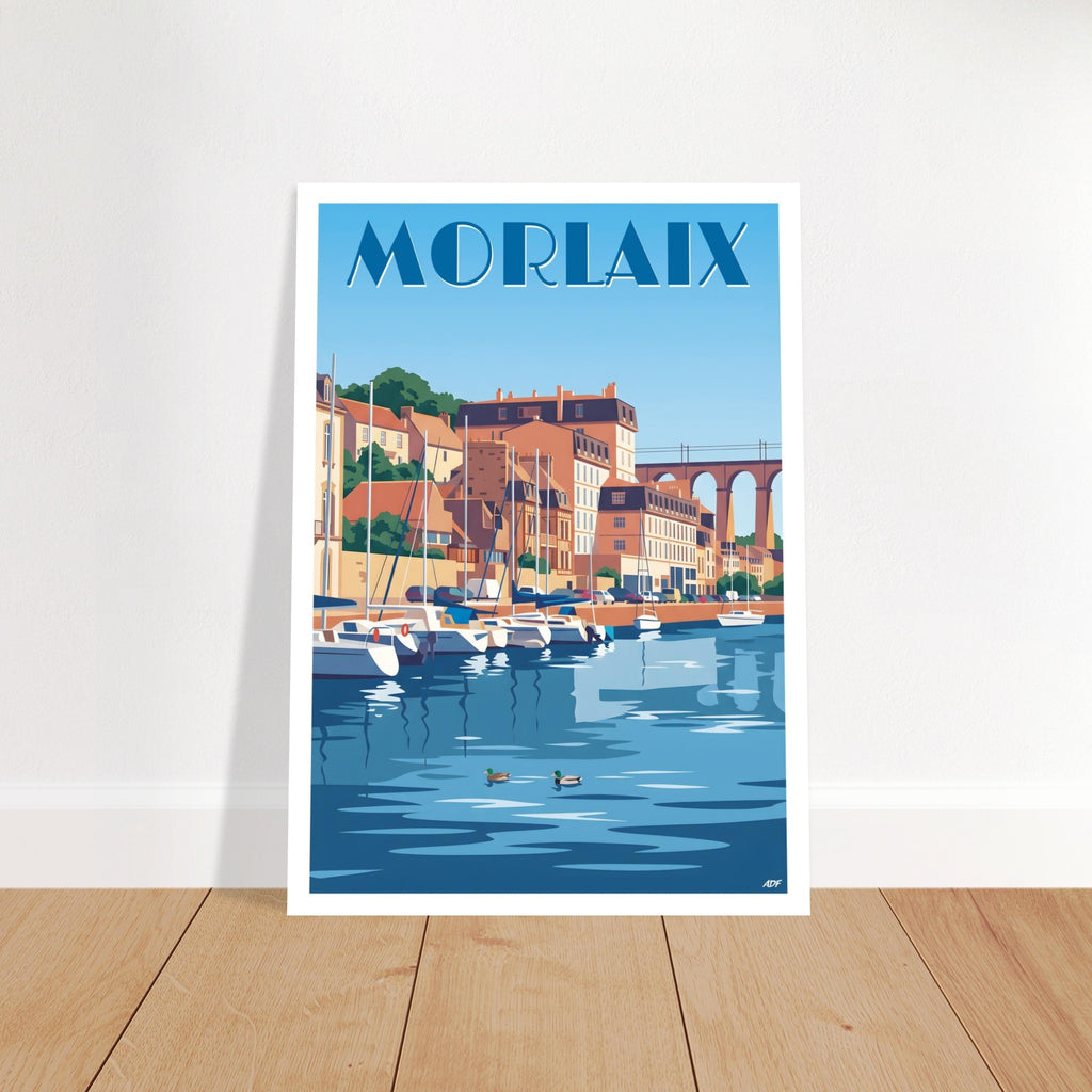 Grand tirage d'art encadré du poster de Morlaix posé sur du parquet en bois