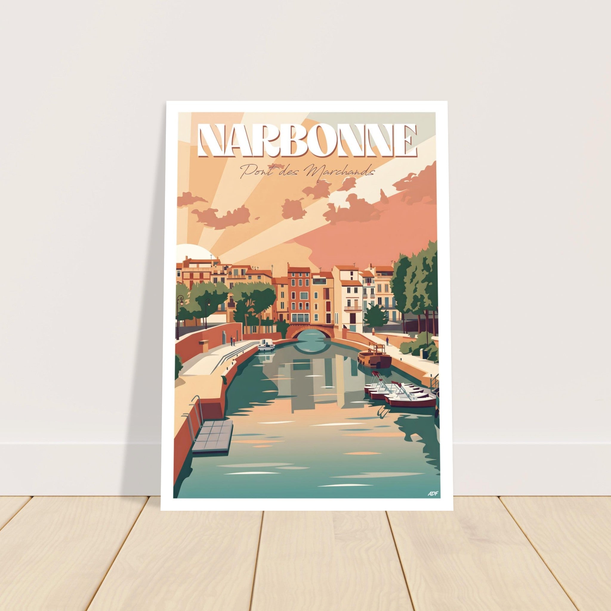 Grand tirage d'art encadré de Narbonne posé au sol sur un parquet