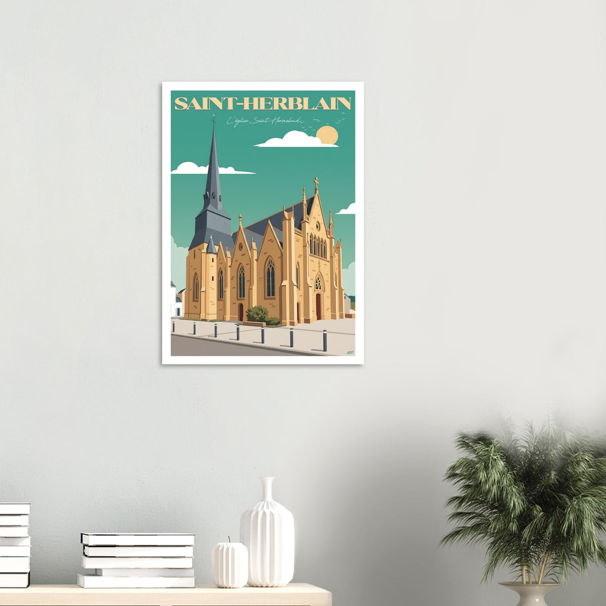 Poster de voyage de Saint-Herblain sous cadre posé sur une console moderne en bois