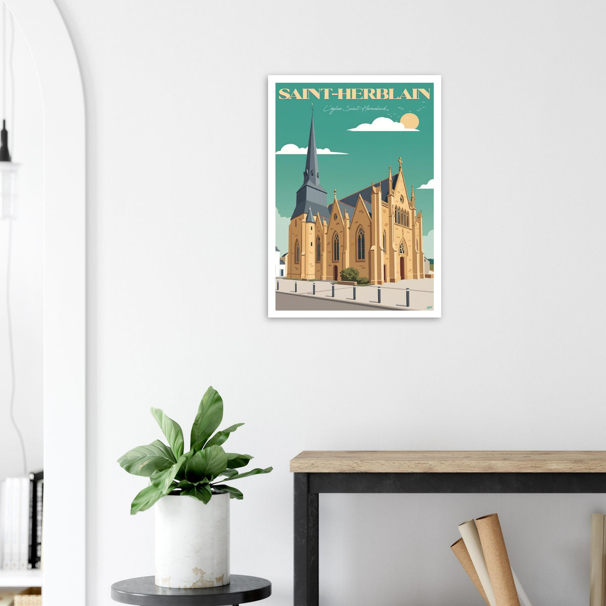 Grand poster encadré de Saint-Herblain posé au sol sur parquet contre un mur blanc
