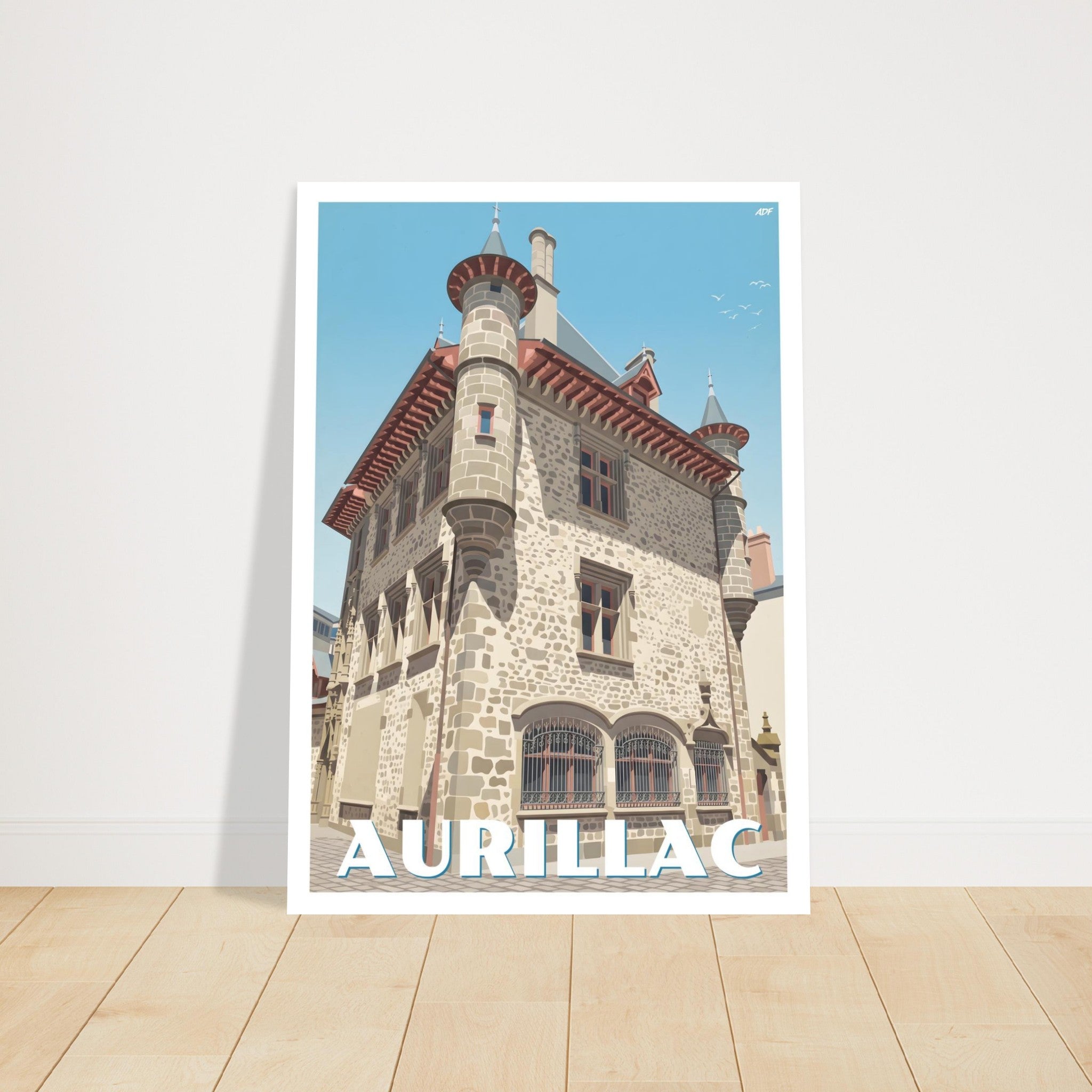 Grand tirage d'art sous cadre du poster d'Aurillac posé au sol sur parquet