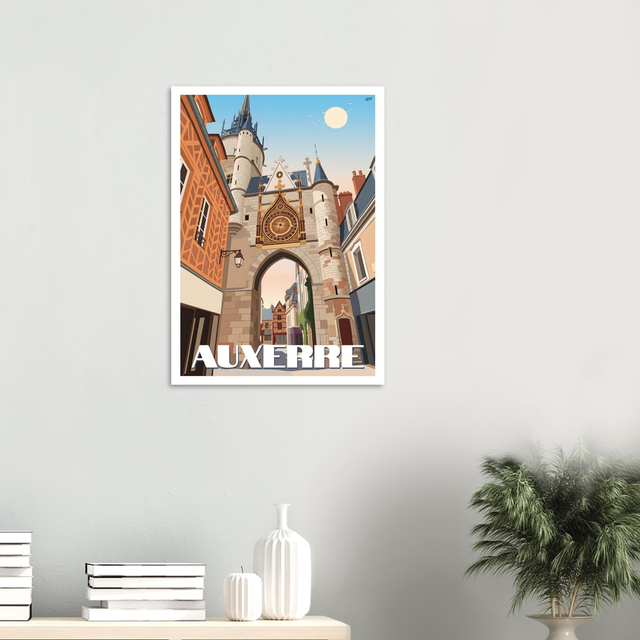Affiche encadrée d'Auxerre fixée au mur dans un intérieur moderne et lumineux