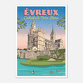 Poster d'Évreux encadré posé sur un buffet scandinave en bois clair à côté d'une lampe moderne
