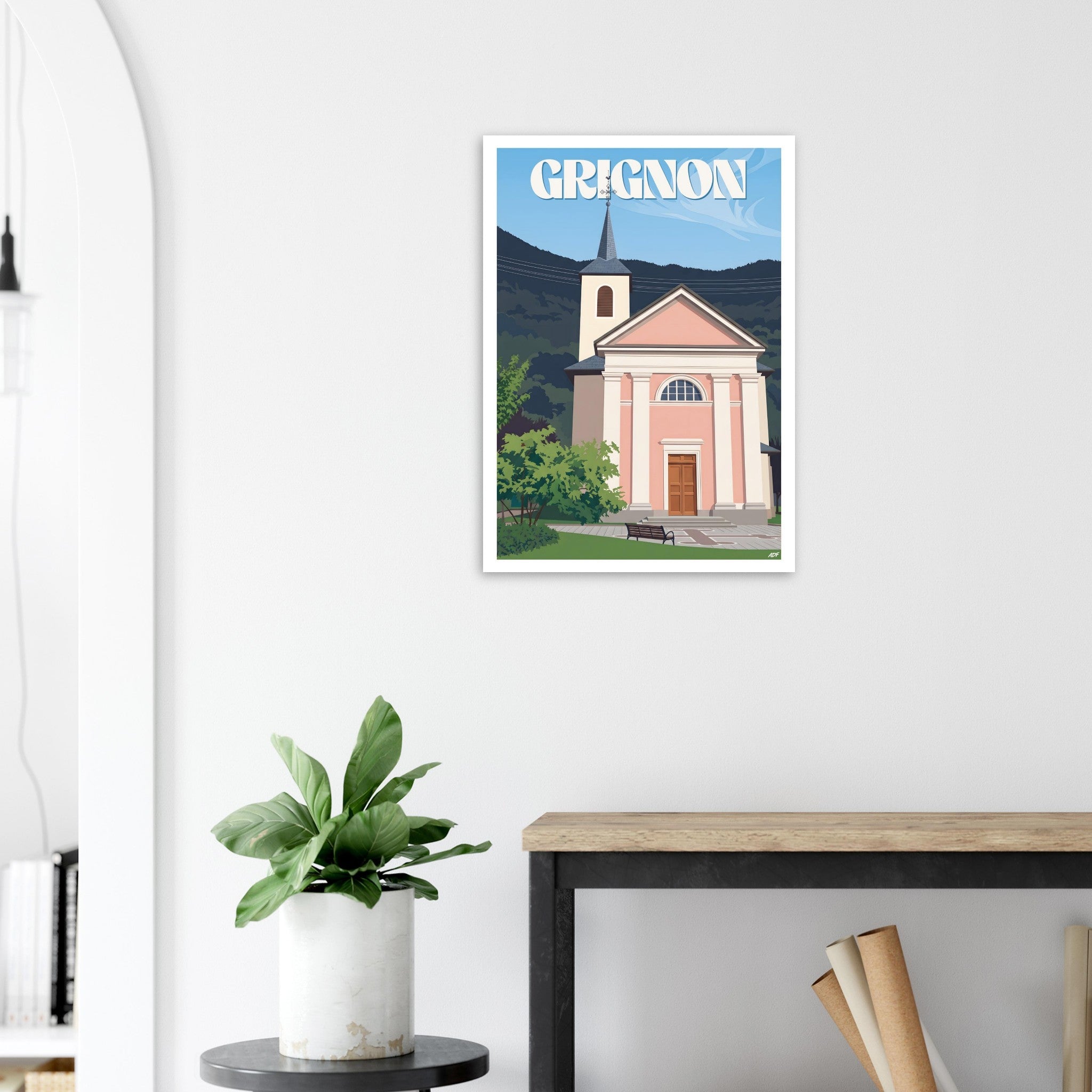 Poster de voyage de Grignon sous cadre posé sur une console en bois clair
