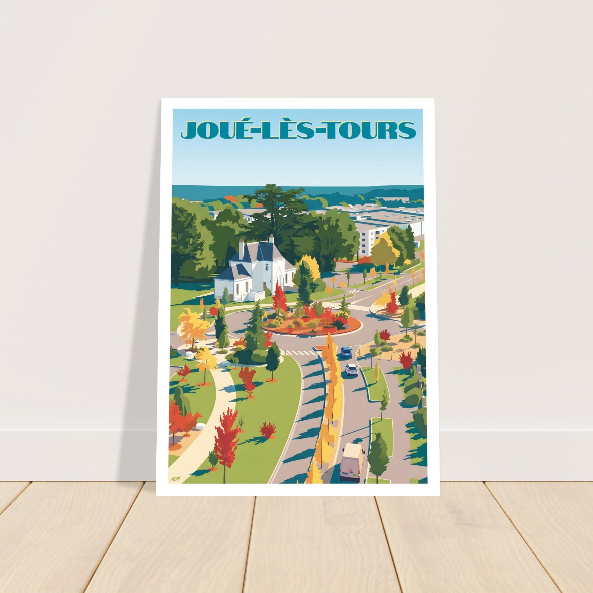 Grand poster d'art sous cadre de Joué-lès-Tours posé au sol sur parquet en bois