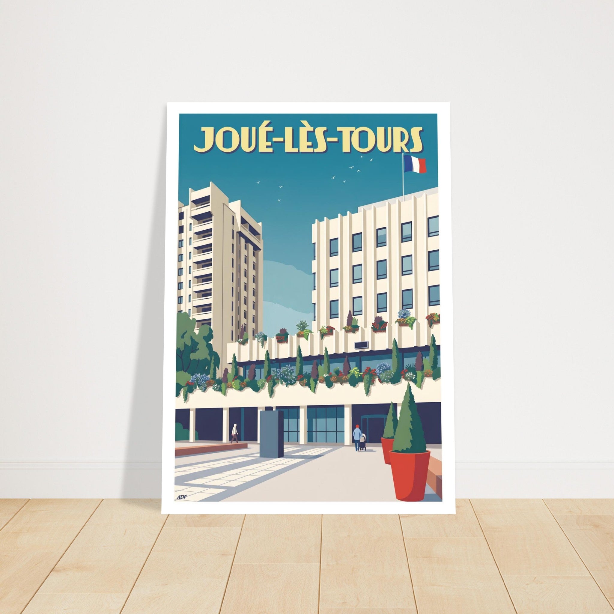 Grand poster d'art sous cadre de Joué-lès-Tours posé au sol sur parquet en bois