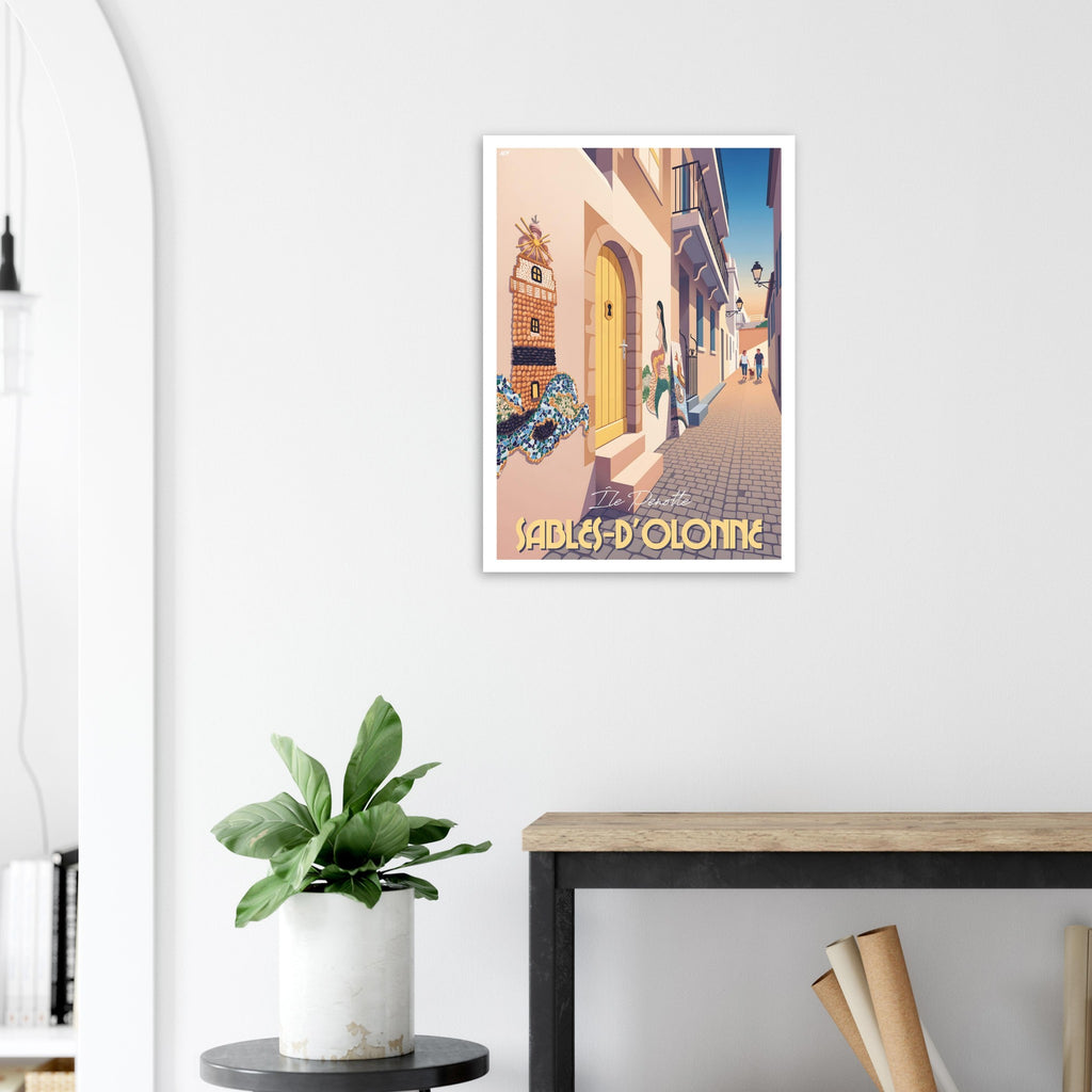 Poster de voyage des Sables-d'Olonne disposé sur une console moderne en bois clair dans une entrée