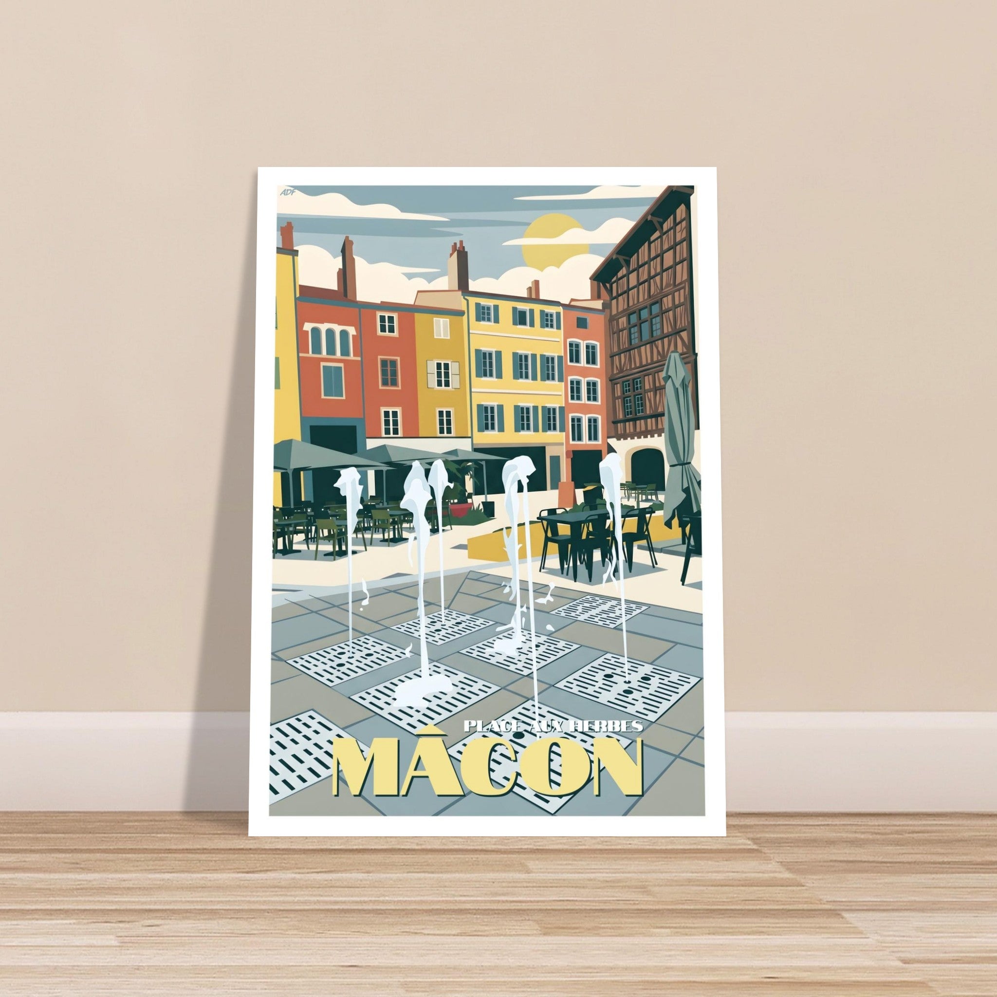 Grand poster encadré de Mâcon posé au sol sur un sol en parquet
